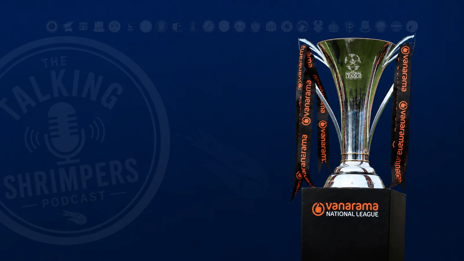 The National League trophy against a deep blue Talking Shrimpers backdrop with a restrained band of club crests.