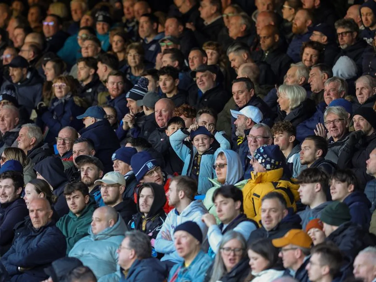 A packed stand of Southend United supporters watching the match.